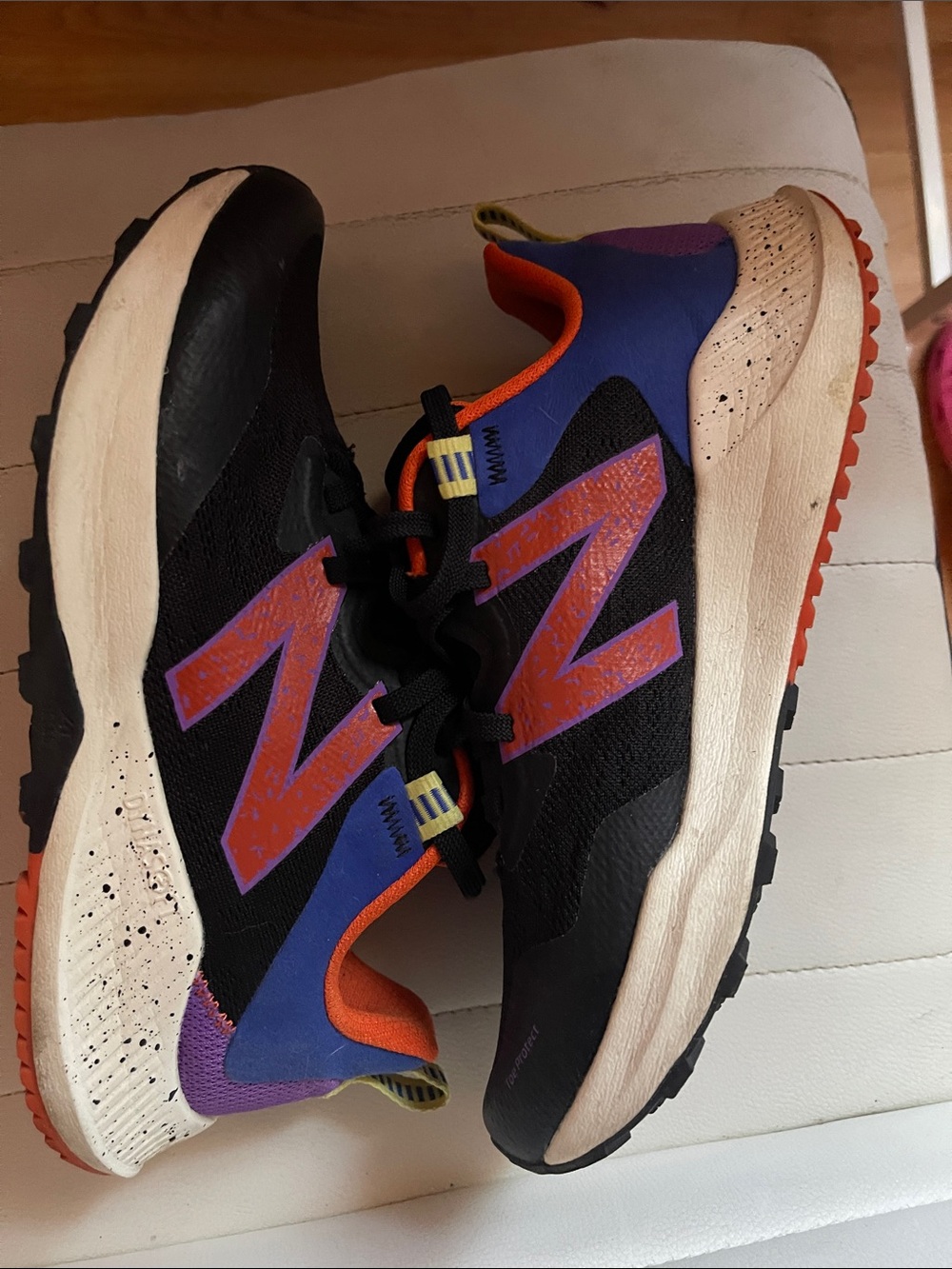 New Balance Women’s Black Sneakers with Orange & Purple Accents